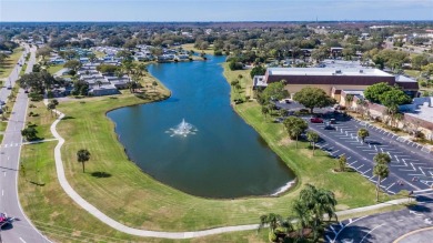 Hoping to live in a home immersed in Florida's natural beauty?
 on Kings Point Executive Golf Course in Florida - for sale on GolfHomes.com, golf home, golf lot