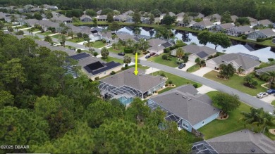 This stunning 4-bedroom saltwater pool home offers both elegance on Plantation Bay Golf and Country Club in Florida - for sale on GolfHomes.com, golf home, golf lot