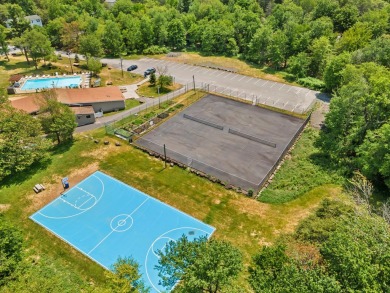 Step into this bright and beautifully styled 3-bedroom, 2-bath on Pocono Farms Country Club in Pennsylvania - for sale on GolfHomes.com, golf home, golf lot