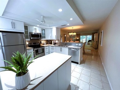 SPECTACULAR EXPANSIVE WATER/GOLF VIEW from this REMODELED 2nd on Wynmoor Golf Course in Florida - for sale on GolfHomes.com, golf home, golf lot