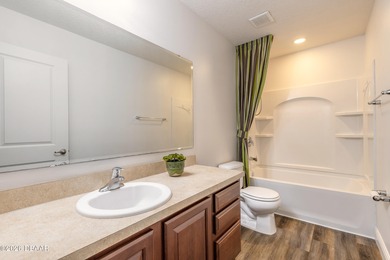 This beautiful, well-maintained home perfectly blends comfort on LPGA International Golf Course in Florida - for sale on GolfHomes.com, golf home, golf lot