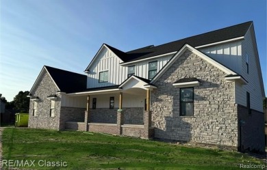 Final touches being completed now on this beautiful new on Prestwick Village Golf Club in Michigan - for sale on GolfHomes.com, golf home, golf lot