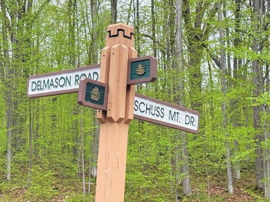 Wooded 2+ acre parcel at the foothills of Schuss Mountain on Schuss Mountain Golf Club in Michigan - for sale on GolfHomes.com, golf home, golf lot