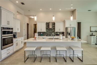 Experience true Florida living in this beautifully appointed on Royal Tee Country Club in Florida - for sale on GolfHomes.com, golf home, golf lot