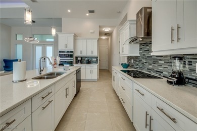 Experience true Florida living in this beautifully appointed on Royal Tee Country Club in Florida - for sale on GolfHomes.com, golf home, golf lot