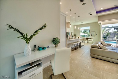 Experience true Florida living in this beautifully appointed on Royal Tee Country Club in Florida - for sale on GolfHomes.com, golf home, golf lot