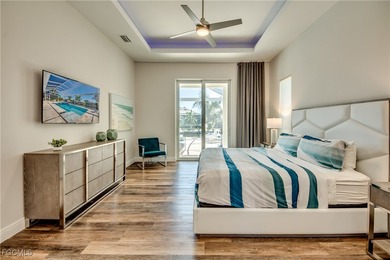 Experience true Florida living in this beautifully appointed on Royal Tee Country Club in Florida - for sale on GolfHomes.com, golf home, golf lot