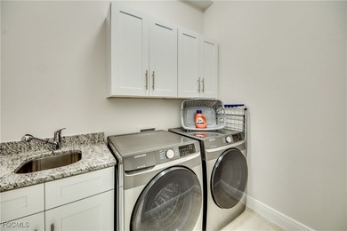 Experience true Florida living in this beautifully appointed on Royal Tee Country Club in Florida - for sale on GolfHomes.com, golf home, golf lot