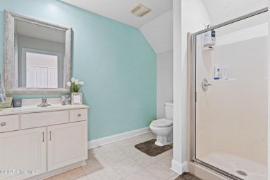 Welcome to your serene retreat in the sought-after beach town of on Oyster Bay Golf Links in North Carolina - for sale on GolfHomes.com, golf home, golf lot