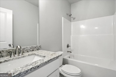 ONLY A FEW HOMES REMAIN IN THE LINKS SECTION OF TRADITOINS OF on Traditions of Braselton Golf Club in Georgia - for sale on GolfHomes.com, golf home, golf lot