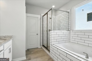 ONLY A FEW HOMES REMAIN IN THE LINKS SECTION OF TRADITOINS OF on Traditions of Braselton Golf Club in Georgia - for sale on GolfHomes.com, golf home, golf lot