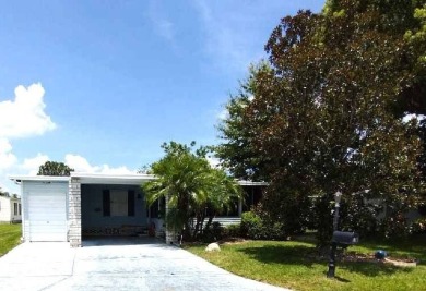 A Camphor tree, Magnolia tree, Bottle Brush tree, lush on Hamptons Golf Club in Florida - for sale on GolfHomes.com, golf home, golf lot