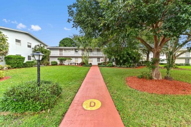 Discover exceptional lakeside living in this rare, rentable on Hillsboro Pines Golf in Florida - for sale on GolfHomes.com, golf home, golf lot