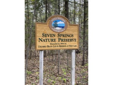 Nicely Wooded, Large Building Lot Located in a great location on Indian River Golf Club in Michigan - for sale on GolfHomes.com, golf home, golf lot