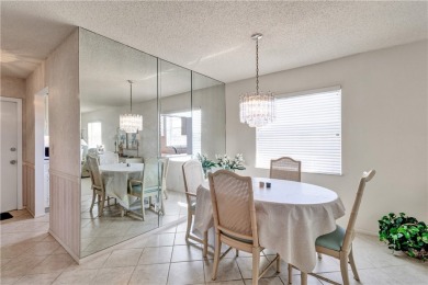 Fully Furnished, turnkey, end unit overlooking the 4th tee and on The American Golf Club in Florida - for sale on GolfHomes.com, golf home, golf lot
