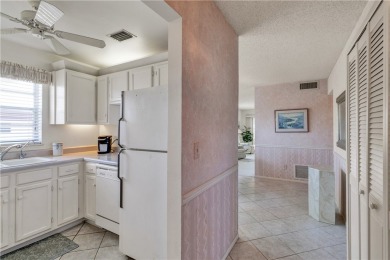 Fully Furnished, turnkey, end unit overlooking the 4th tee and on The American Golf Club in Florida - for sale on GolfHomes.com, golf home, golf lot