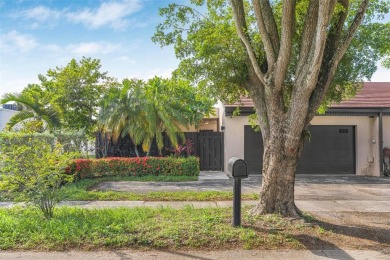 Stunning corner 2/2 townhome located in the desirable Country on Country Club of Miami in Florida - for sale on GolfHomes.com, golf home, golf lot