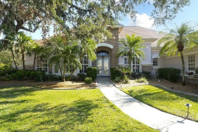 This Arthur Rutenberg built home is situated on a wooded double on River Wilderness Golf and Country Club in Florida - for sale on GolfHomes.com, golf home, golf lot