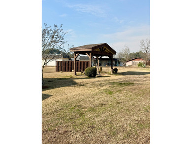 At the quiet end of a cul-de-sac in Country Club Estates, this on Idabel Country Club in Oklahoma - for sale on GolfHomes.com, golf home, golf lot