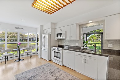 Enjoy serene lakefront views from this beautifully updated on Jonathans Landing Golf Club in Florida - for sale on GolfHomes.com, golf home, golf lot