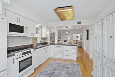 Enjoy serene lakefront views from this beautifully updated on Jonathans Landing Golf Club in Florida - for sale on GolfHomes.com, golf home, golf lot