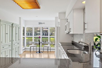 Enjoy serene lakefront views from this beautifully updated on Jonathans Landing Golf Club in Florida - for sale on GolfHomes.com, golf home, golf lot