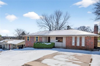 Welcome home to this well-maintained three bedroom, two bath on Cedars Country Club in Arkansas - for sale on GolfHomes.com, golf home, golf lot