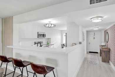 Stunning fully remodeled 1,370 SF first-floor residence blending on Sunrise Lakes Phase IV Golf Course in Florida - for sale on GolfHomes.com, golf home, golf lot