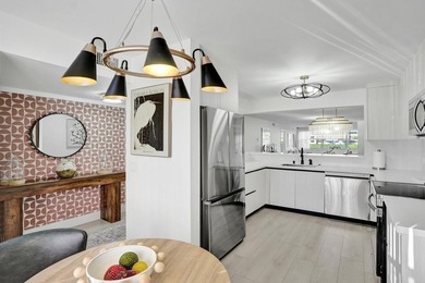 Stunning fully remodeled 1,370 SF first-floor residence blending on Sunrise Lakes Phase IV Golf Course in Florida - for sale on GolfHomes.com, golf home, golf lot