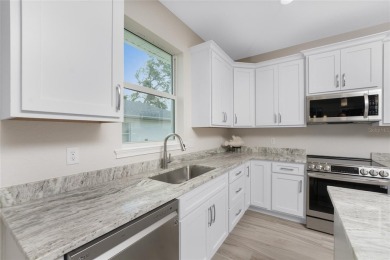 Why build when you can own this extraordinary 2023-built on Rotonda Golf and Country Club The Palms Course in Florida - for sale on GolfHomes.com, golf home, golf lot