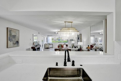 Stunning fully remodeled 1,370 SF first-floor residence blending on Sunrise Lakes Phase IV Golf Course in Florida - for sale on GolfHomes.com, golf home, golf lot