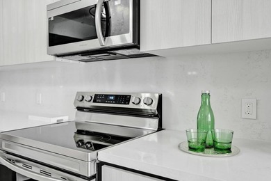 Stunning fully remodeled 1,370 SF first-floor residence blending on Sunrise Lakes Phase IV Golf Course in Florida - for sale on GolfHomes.com, golf home, golf lot