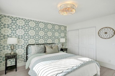 Stunning fully remodeled 1,370 SF first-floor residence blending on Sunrise Lakes Phase IV Golf Course in Florida - for sale on GolfHomes.com, golf home, golf lot