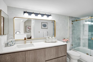 Stunning fully remodeled 1,370 SF first-floor residence blending on Sunrise Lakes Phase IV Golf Course in Florida - for sale on GolfHomes.com, golf home, golf lot