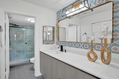 Stunning fully remodeled 1,370 SF first-floor residence blending on Sunrise Lakes Phase IV Golf Course in Florida - for sale on GolfHomes.com, golf home, golf lot