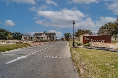 Step right off the 9th hole into your backyard for a barbecue! on The Golf Club at Resort Eagle Mountain Lake in Texas - for sale on GolfHomes.com, golf home, golf lot