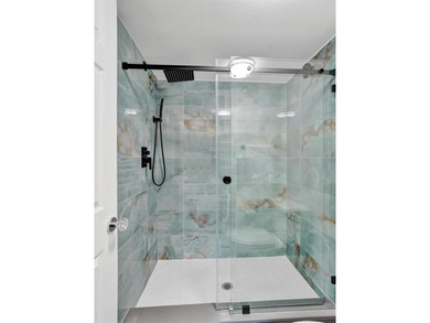 Stunning fully remodeled 1,370 SF first-floor residence blending on Sunrise Lakes Phase IV Golf Course in Florida - for sale on GolfHomes.com, golf home, golf lot