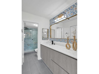 Stunning fully remodeled 1,370 SF first-floor residence blending on Sunrise Lakes Phase IV Golf Course in Florida - for sale on GolfHomes.com, golf home, golf lot