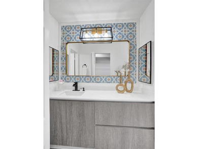 Stunning fully remodeled 1,370 SF first-floor residence blending on Sunrise Lakes Phase IV Golf Course in Florida - for sale on GolfHomes.com, golf home, golf lot