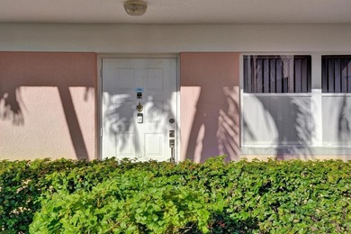 Stunning fully remodeled 1,370 SF first-floor residence blending on Sunrise Lakes Phase IV Golf Course in Florida - for sale on GolfHomes.com, golf home, golf lot