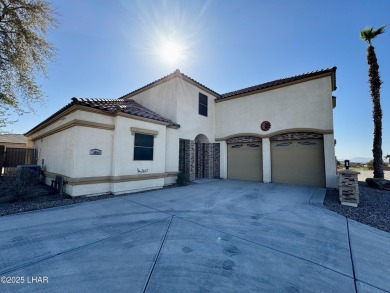 This spacious 2-story custom pool home in the gated Los Lagos on Los Lagos Golf Club in Arizona - for sale on GolfHomes.com, golf home, golf lot
