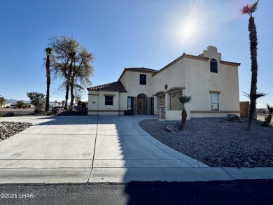 This spacious 2-story custom pool home in the gated Los Lagos on Los Lagos Golf Club in Arizona - for sale on GolfHomes.com, golf home, golf lot