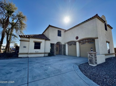 This spacious 2-story custom pool home in the gated Los Lagos on Los Lagos Golf Club in Arizona - for sale on GolfHomes.com, golf home, golf lot