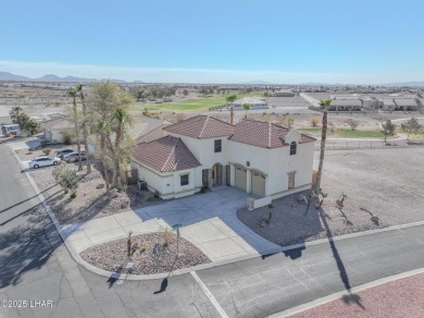 This spacious 2-story custom pool home in the gated Los Lagos on Los Lagos Golf Club in Arizona - for sale on GolfHomes.com, golf home, golf lot