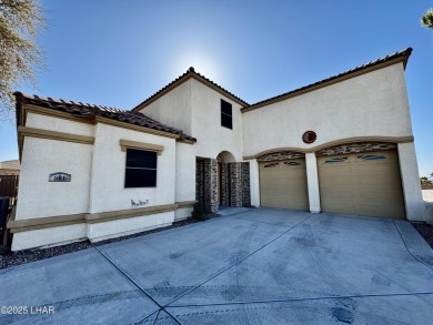 This spacious 2-story custom pool home in the gated Los Lagos on Los Lagos Golf Club in Arizona - for sale on GolfHomes.com, golf home, golf lot