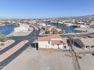 This spacious 2-story custom pool home in the gated Los Lagos on Los Lagos Golf Club in Arizona - for sale on GolfHomes.com, golf home, golf lot
