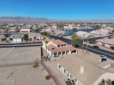 This spacious 2-story custom pool home in the gated Los Lagos on Los Lagos Golf Club in Arizona - for sale on GolfHomes.com, golf home, golf lot
