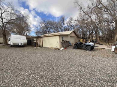 Nestled under the Colorado National Monument, with on Tiara Rado Golf Course in Colorado - for sale on GolfHomes.com, golf home, golf lot