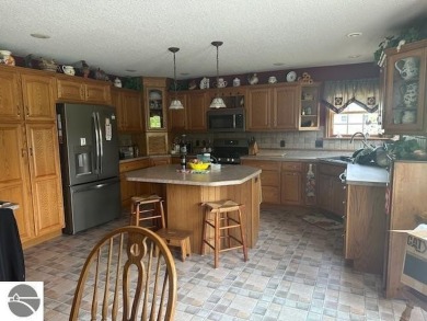 CHIC - ELEGANT - SPACIOUS!  Step into this warm and welcoming on The Pines Golf Course at Lake Isabella in Michigan - for sale on GolfHomes.com, golf home, golf lot