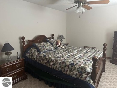 CHIC - ELEGANT - SPACIOUS!  Step into this warm and welcoming on The Pines Golf Course at Lake Isabella in Michigan - for sale on GolfHomes.com, golf home, golf lot